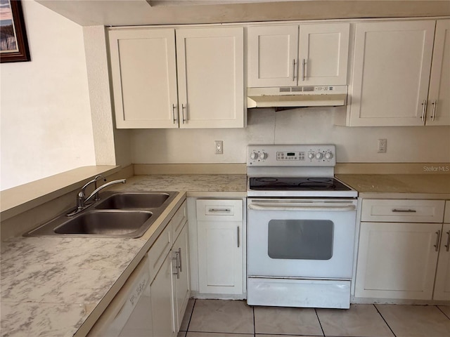 kitchen featuring white appliances, light countertops, a sink, and under cabinet range hood