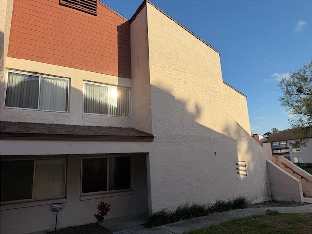 view of home's exterior with stucco siding