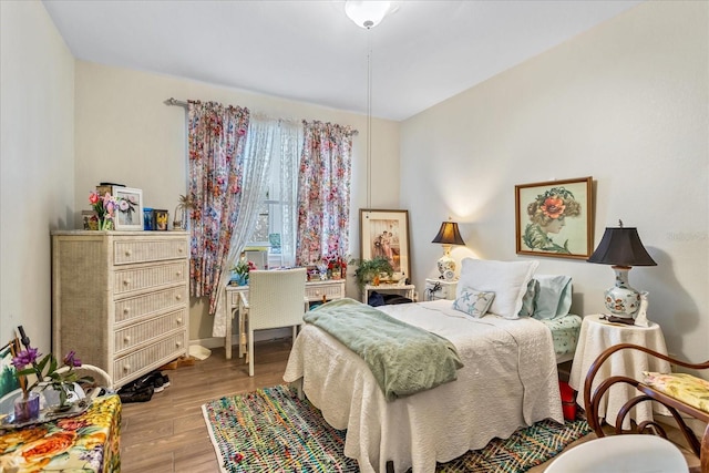 bedroom with wood finished floors