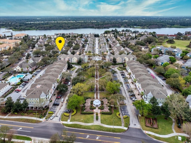 bird's eye view with a water view and a residential view