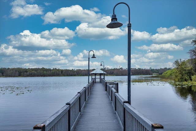 view of dock featuring a water view and a gazebo