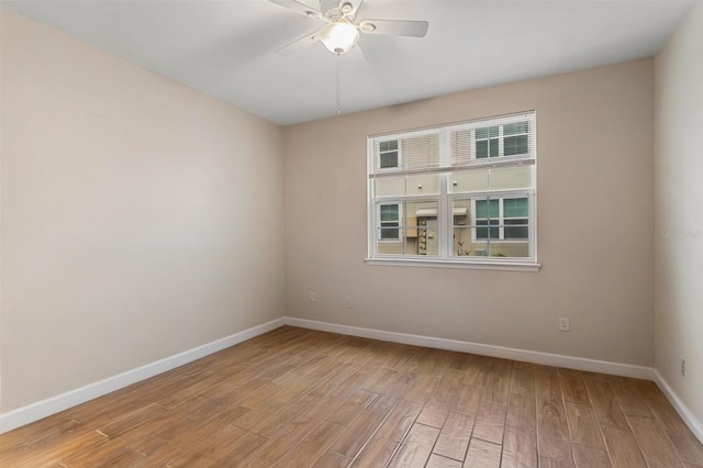 3368 Parkchester Square Blvd Unit 104, Orlando, FL 32835 - unfurnished room with light wood-style flooring, baseboards, and a ceiling fan