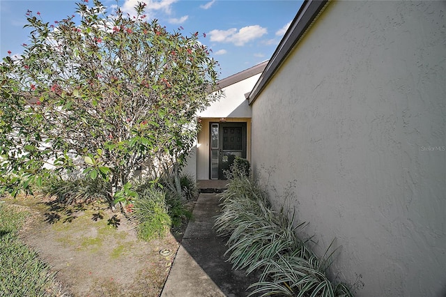 exterior space with stucco siding