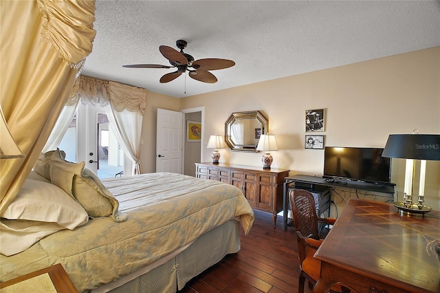 bedroom featuring dark wood-style floors, ceiling fan, and a textured ceiling