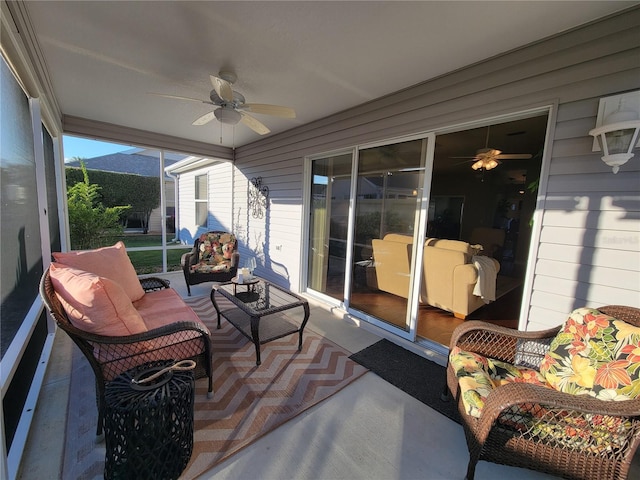 sunroom / solarium featuring ceiling fan