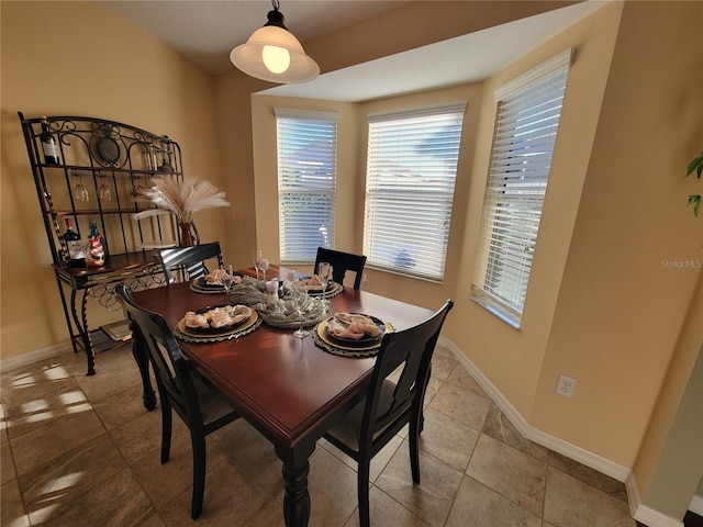 dining space with baseboards