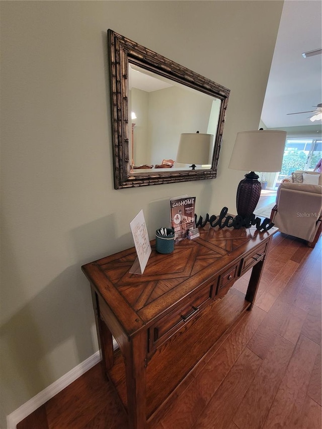 interior space with wood finished floors, visible vents, and baseboards