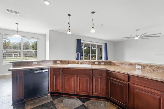 kitchen with a sink, visible vents, black dishwasher, stone finish floor, and decorative light fixtures