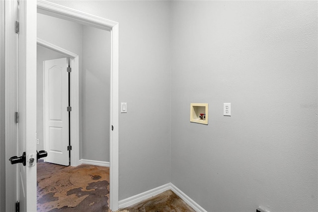 washroom featuring hookup for a washing machine, laundry area, and baseboards