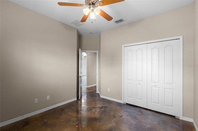 unfurnished bedroom featuring baseboards, visible vents, a ceiling fan, finished concrete floors, and a closet