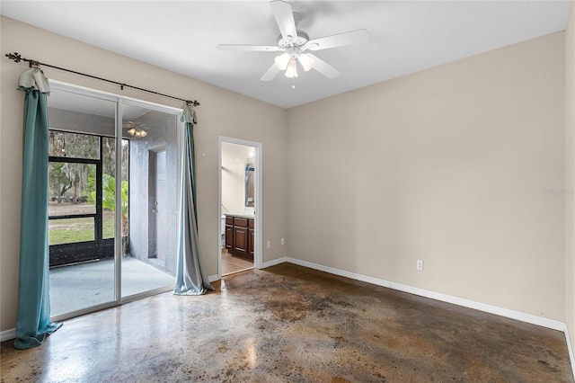 spare room featuring baseboards and a ceiling fan