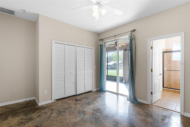 unfurnished bedroom featuring finished concrete flooring, visible vents, baseboards, access to outside, and a closet