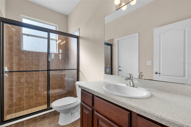 full bath featuring toilet, tile patterned floors, a shower stall, and vanity