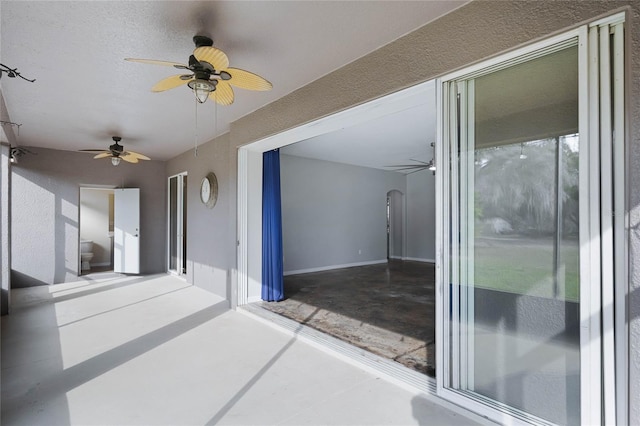 interior space featuring ceiling fan