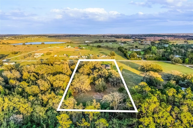 drone / aerial view with a rural view and a water view