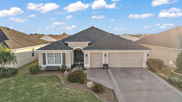 ranch-style home with an attached garage, a shingled roof, concrete driveway, stucco siding, and a front lawn