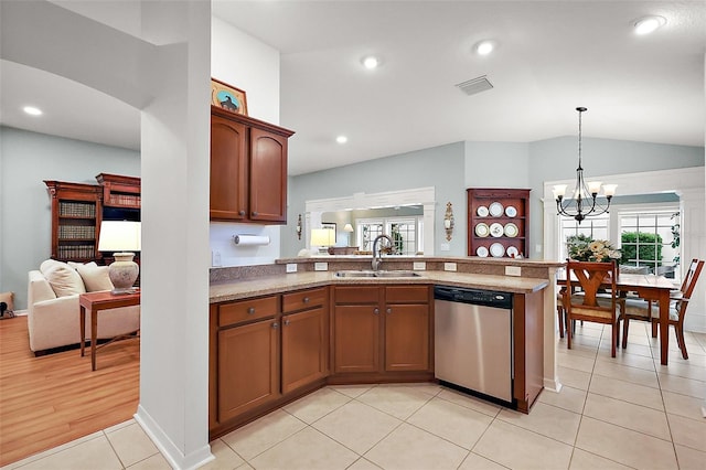 kitchen featuring a notable chandelier, visible vents, stainless steel dishwasher, a sink, and a peninsula