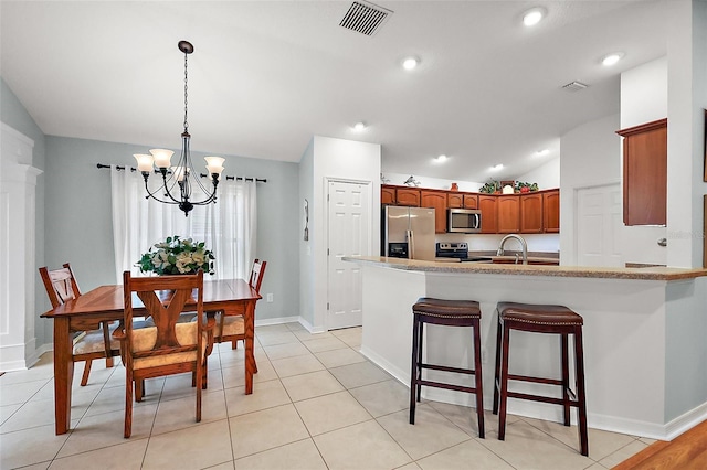 dining area with recessed lighting, visible vents, vaulted ceiling, a chandelier, and baseboards