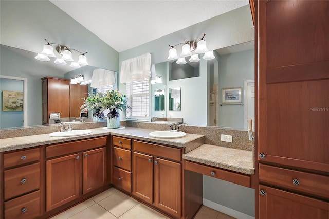 full bath with vaulted ceiling, double vanity, a sink, and tile patterned floors