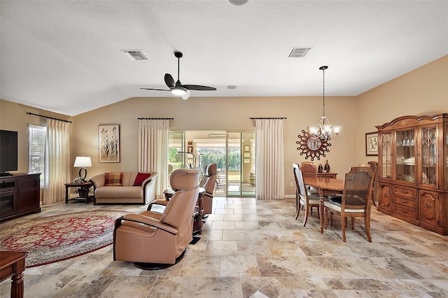 living room featuring lofted ceiling, visible vents, and ceiling fan with notable chandelier