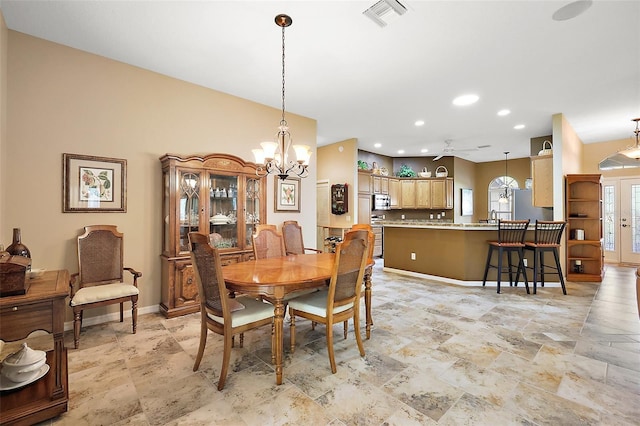 dining area with an inviting chandelier, baseboards, visible vents, and recessed lighting