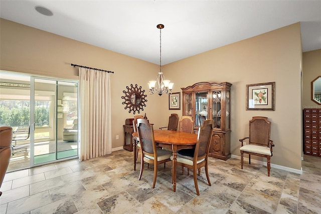 dining room with baseboards and a notable chandelier