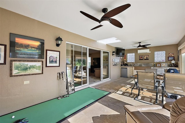 view of patio / terrace featuring a ceiling fan and a wall mounted air conditioner