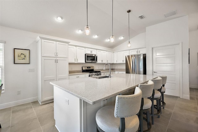 kitchen featuring white cabinetry, visible vents, appliances with stainless steel finishes, and a sink