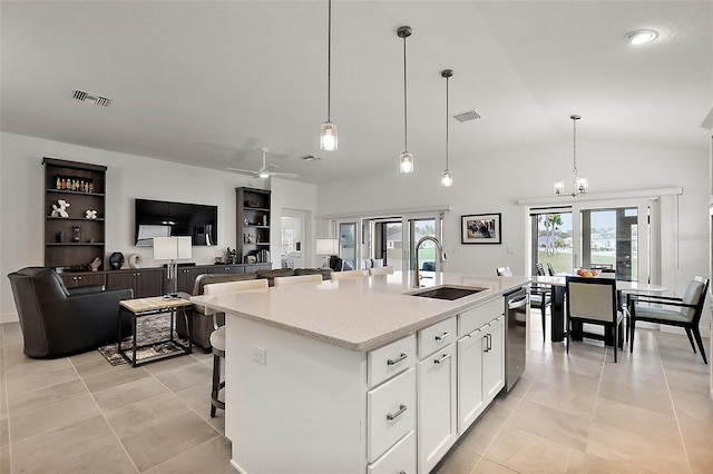 kitchen with dishwasher, a sink, visible vents, and white cabinets