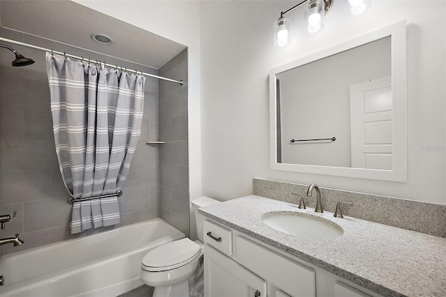 bathroom featuring vanity, toilet, and shower / tub combo with curtain