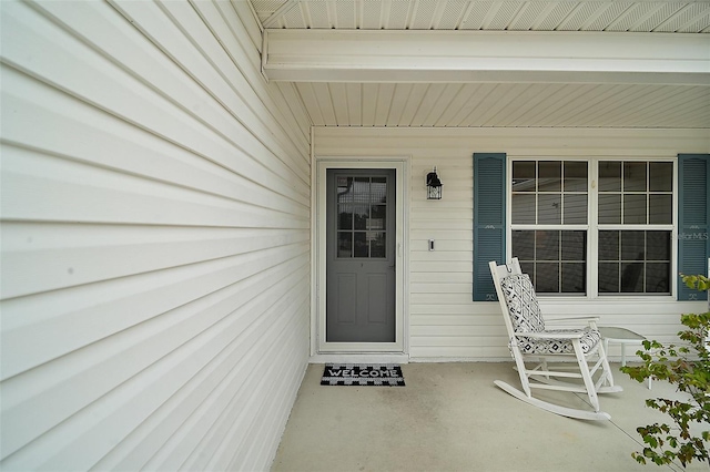 view of exterior entry featuring a porch