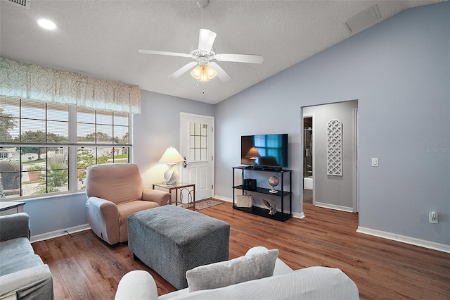 living area with lofted ceiling, ceiling fan, wood finished floors, and baseboards