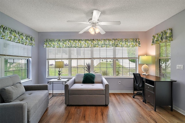 interior space with ceiling fan