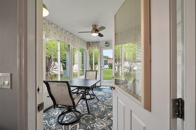 sunroom / solarium with ceiling fan