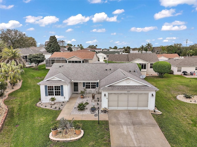 ranch-style house featuring roof with shingles, concrete driveway, an attached garage, a residential view, and a front lawn