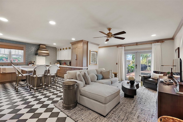 living room featuring dark floors, french doors, recessed lighting, ornamental molding, and a ceiling fan