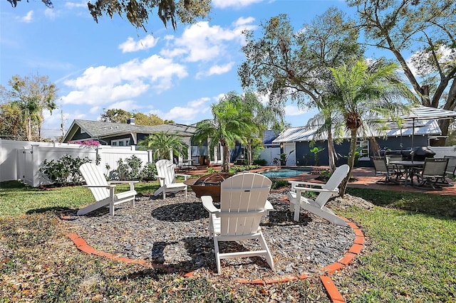 view of yard with fence, a fenced in pool, and a patio