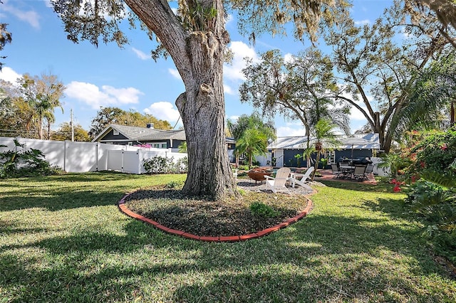 view of yard with a fenced backyard and a patio