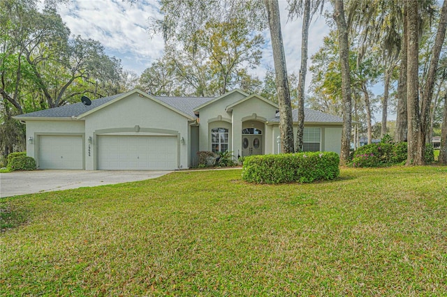 ranch-style house featuring a garage, driveway, a front lawn, and stucco siding