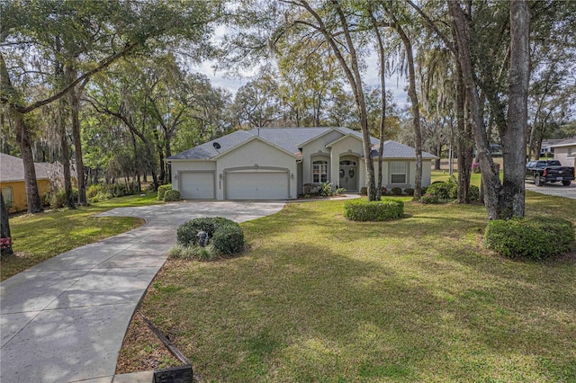 single story home with a garage, a front yard, concrete driveway, and stucco siding