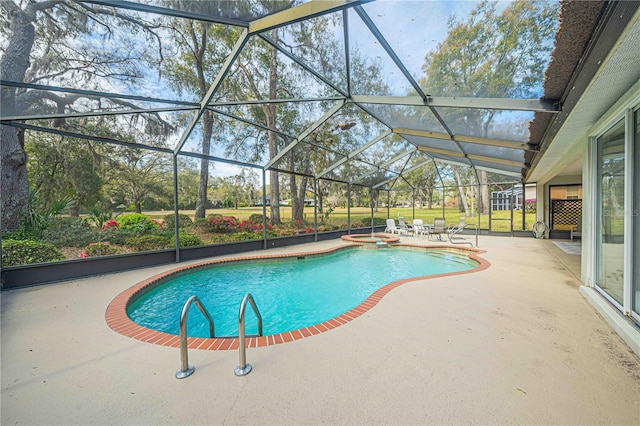 view of pool with glass enclosure, a patio area, and a pool with connected hot tub