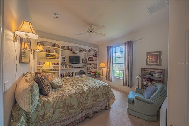 bedroom featuring a ceiling fan, carpet, and visible vents