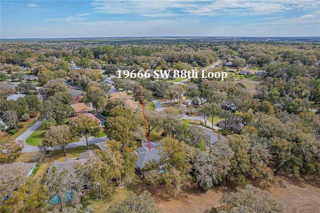 aerial view with a wooded view