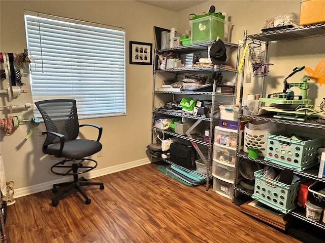 office space featuring wood finished floors and baseboards