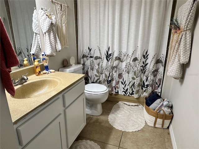 full bath with toilet, tile patterned flooring, and vanity