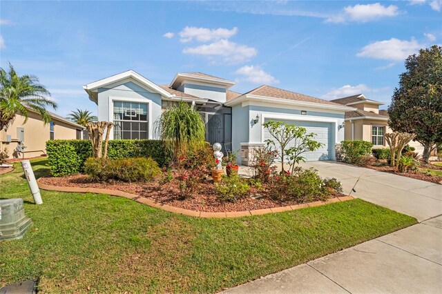 8780 Bridgeport Bay Cir, Mount Dora, FL 32757 - view of front of home with stucco siding, a front yard, a garage, and driveway