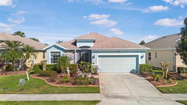 8780 Bridgeport Bay Cir, Mount Dora, FL 32757 - single story home featuring stucco siding, a front yard, a garage, concrete driveway, and a shingled roof