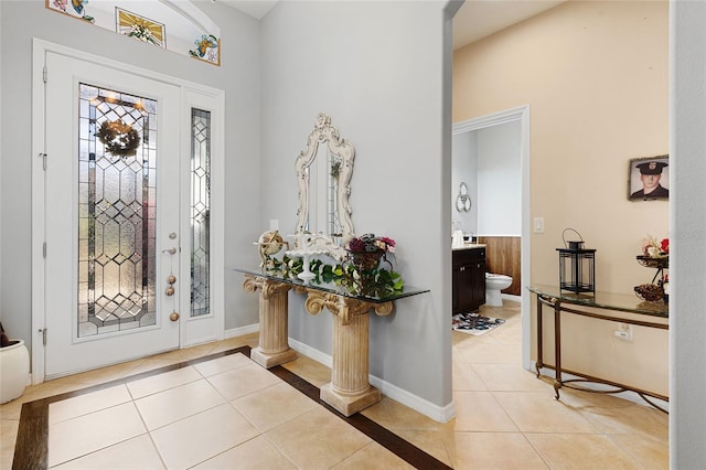 8780 Bridgeport Bay Cir, Mount Dora, FL 32757 - entrance foyer with light tile patterned floors and baseboards