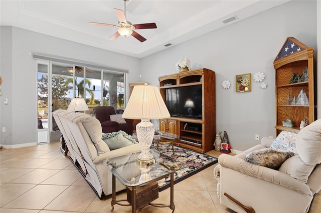 8780 Bridgeport Bay Cir, Mount Dora, FL 32757 - living area with ceiling fan, light tile patterned floors, baseboards, a raised ceiling, and ornamental molding