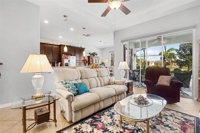8780 Bridgeport Bay Cir, Mount Dora, FL 32757 - living area featuring ceiling fan, light tile patterned floors, recessed lighting, and ornamental molding